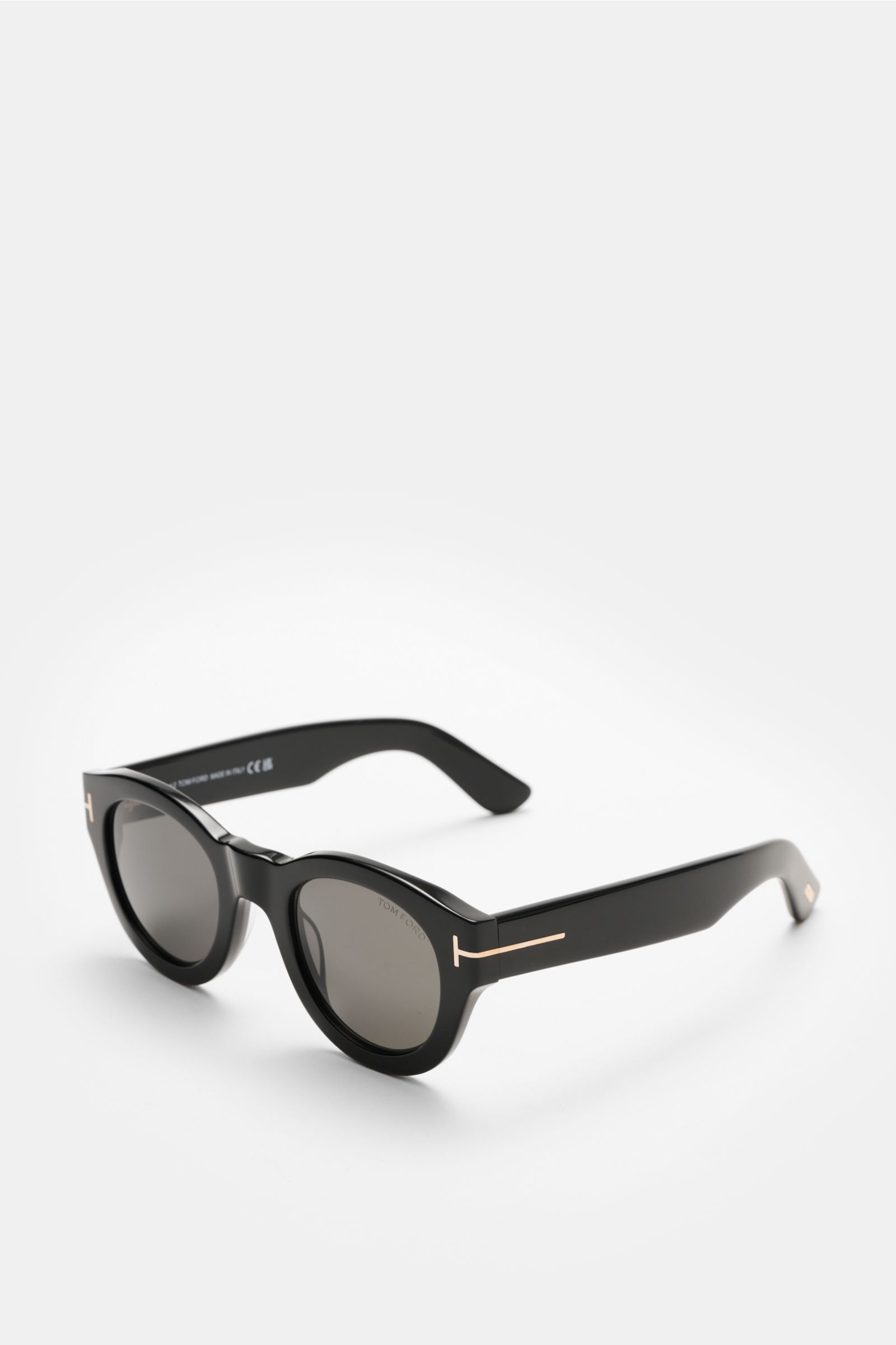 Tom Ford Sonnenbrille 'Lucinda' schwarz, gerundete Silhouette, Acetat-Rahmen, gleichmäßig getönte Gläser, seitliche Perspektive, UV-Schutz, Samt-Etui.