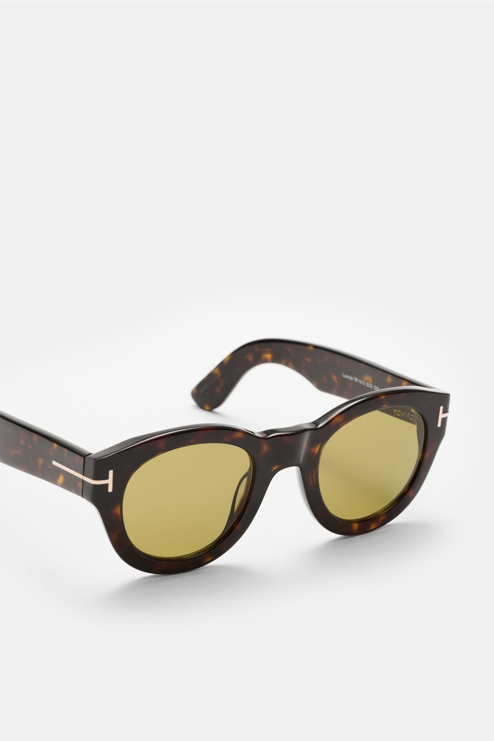 Tom Ford Sonnenbrille 'Lucinda' dunkelbraun meliert, gerundete Silhouette, Acetat-Rahmen, getönte Gläser, seitliche Perspektive, 100% UV-Schutz.