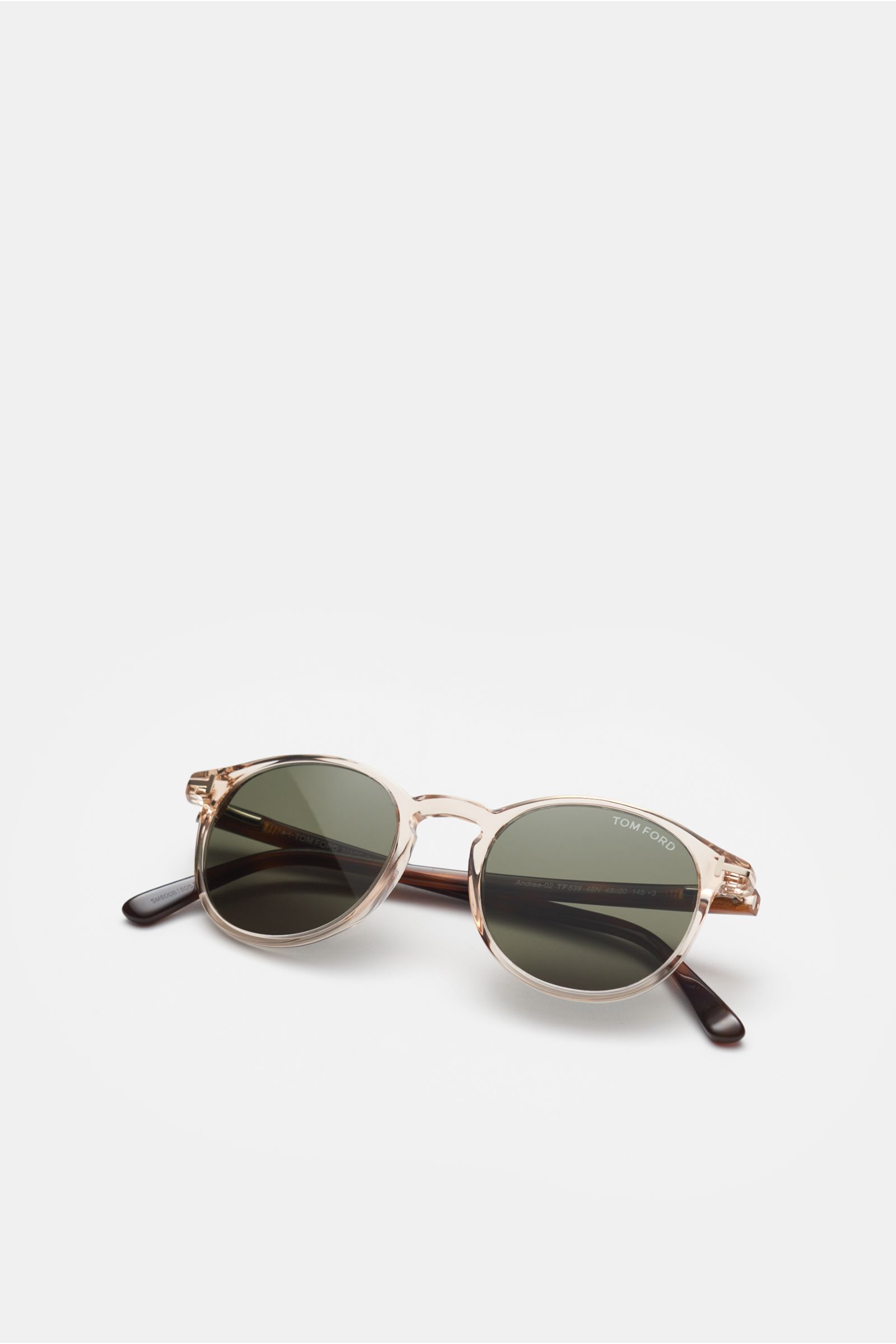 Front-angle view of Tom Ford Sonnenbrille 'Andrea' beige/braun gemustert/grün with round transparent acetate frame, tortoiseshell temples, and green plastic lenses offering 100% UV protection.