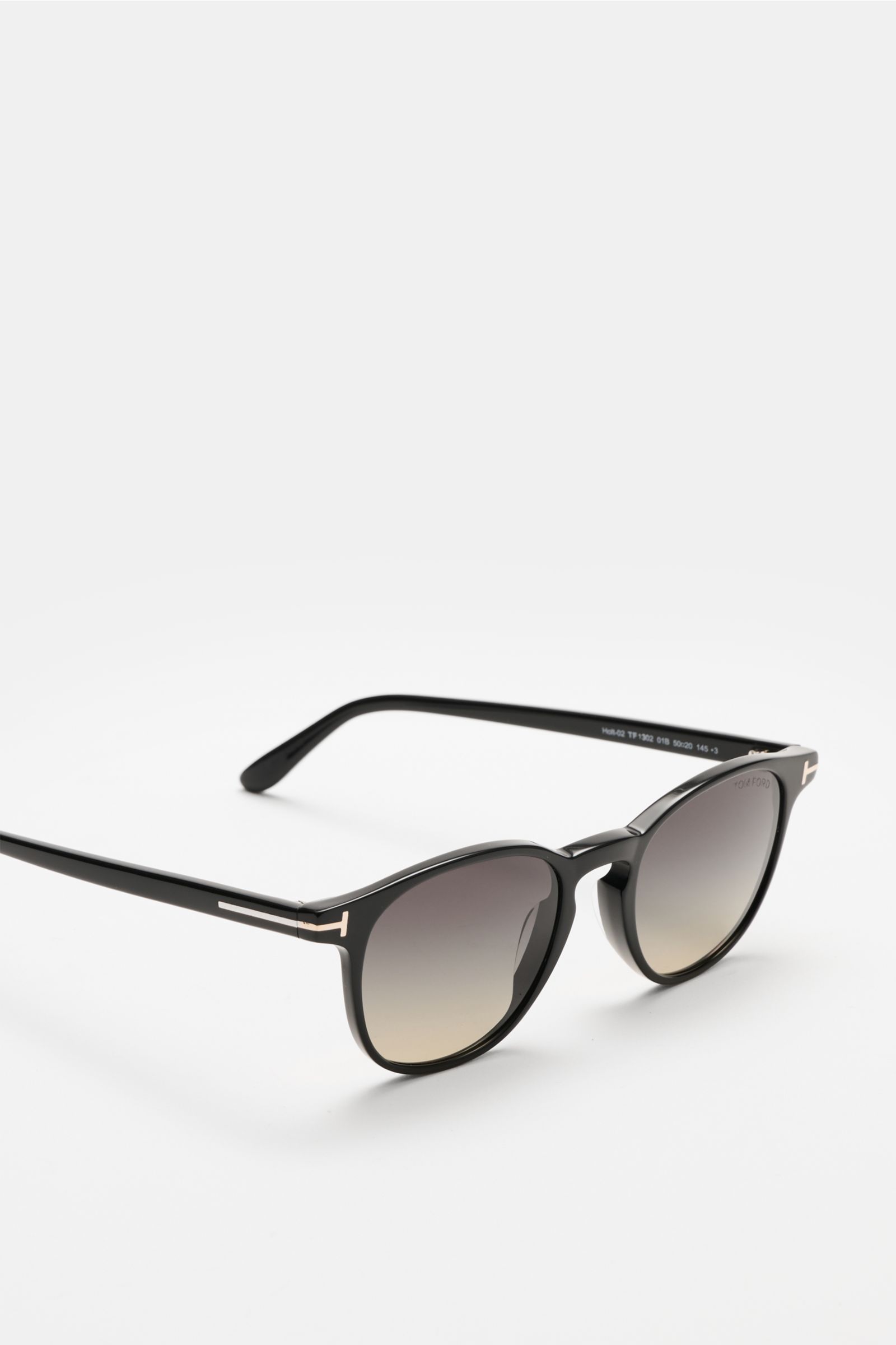 Tom Ford Sonnenbrille 'Holt' schwarz, seitliche Nahaufnahme, leicht gerundete Silhouette, melierter Acetat-Rahmen, getönte Kunststoffgläser, 100% UV-Schutz, inkl. Samt-Hartschalenetui.