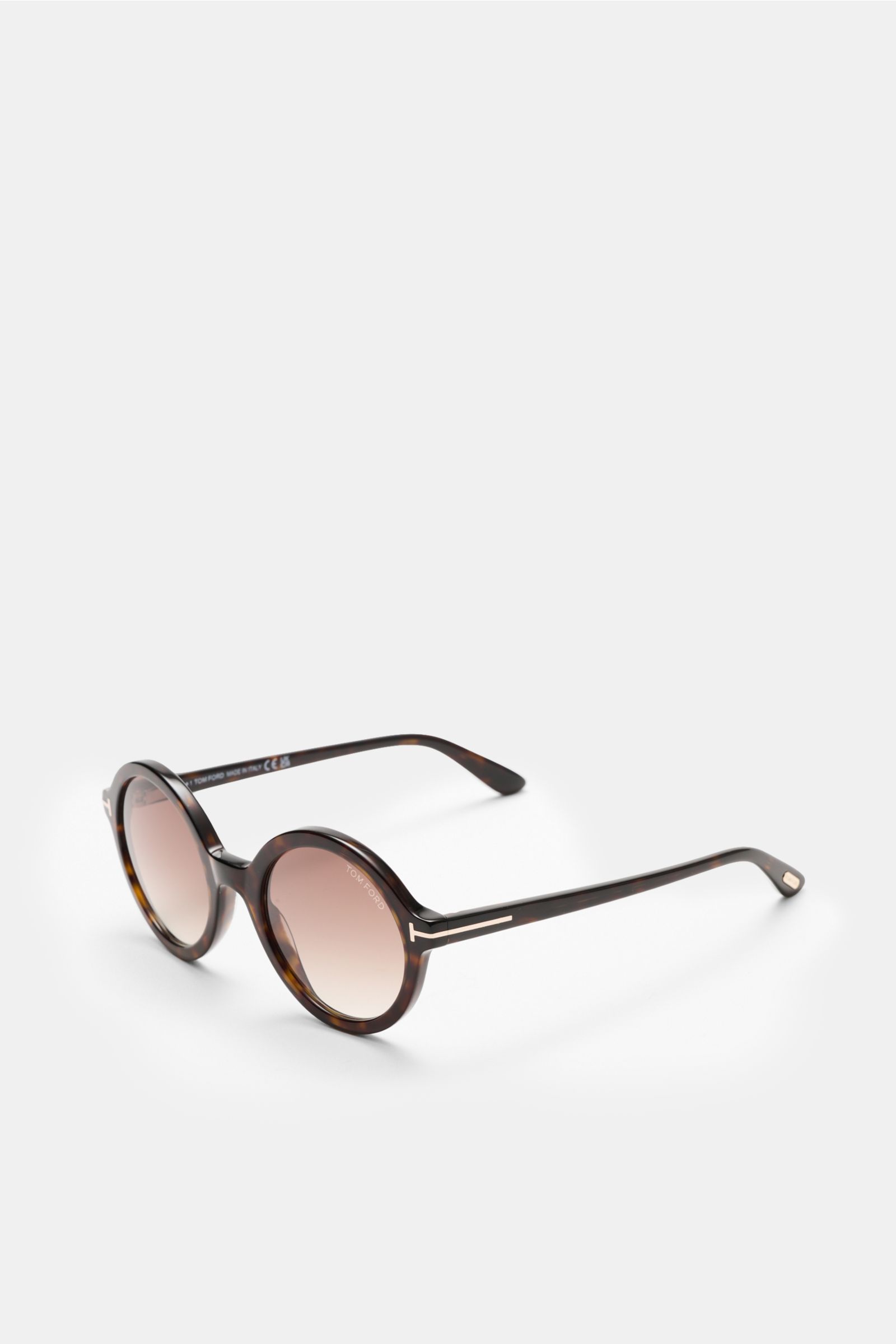 Tom Ford Sunglasses 'Nicolet' dark brown patterned shown from a front-side angle, featuring a round tortoiseshell acetate frame with evenly tinted plastic lenses and signature ‘T’ detail. 

The 'Nicolette' sunglasses from TOM FORD impress with their ey
