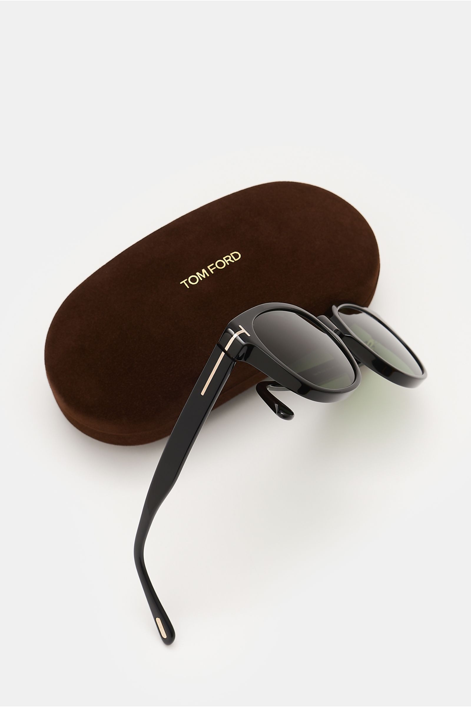 Tom Ford Sonnenbrille 'Mert' schwarz seitlich fotografiert, Acetat-Rahmen, melierte Optik, leicht gerundete Silhouette, getönte Gläser, UV-Schutz, Samt-Hartschalenetui.