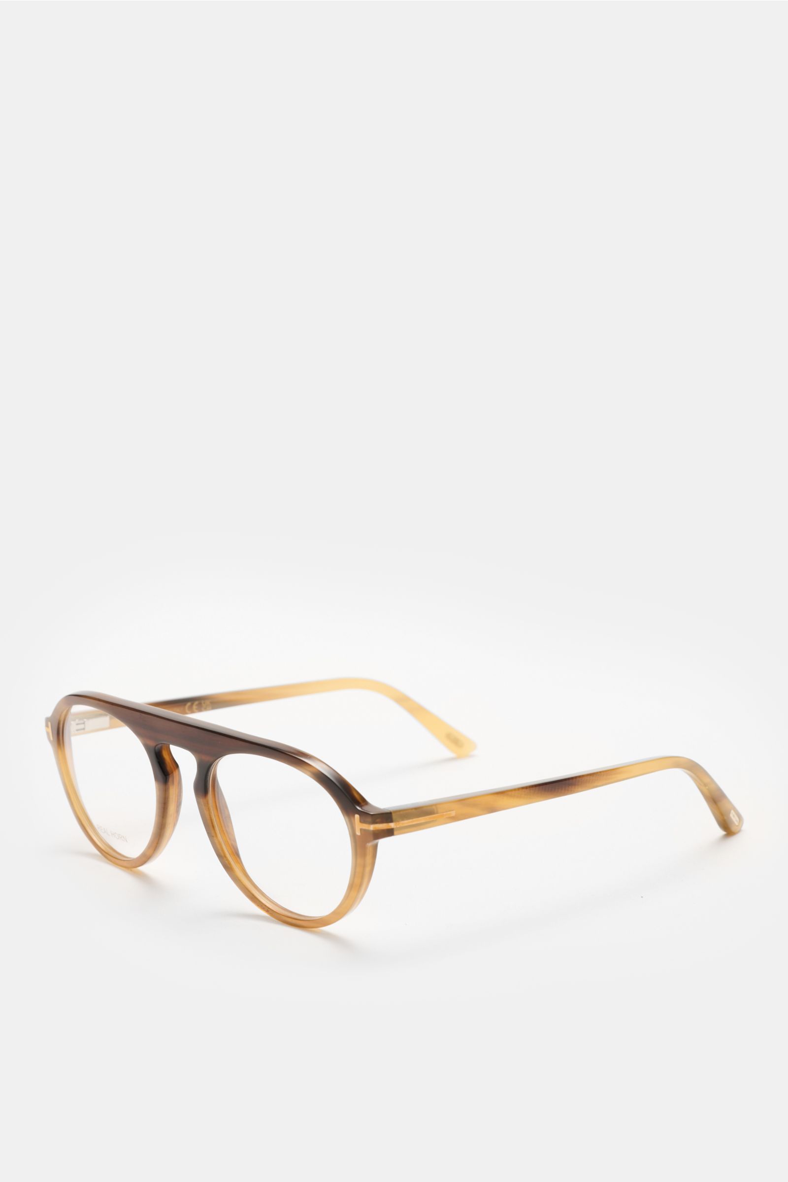 Tom Ford Horn Brille 'Private Collection' graubraun/sand gemustert round horn frame with blue light filter lenses, T-shaped details, photographed from front side angle. Stilvoller Eyecatcher: Die exklusive Horn Brille aus der 'Private Collection' von TOM 