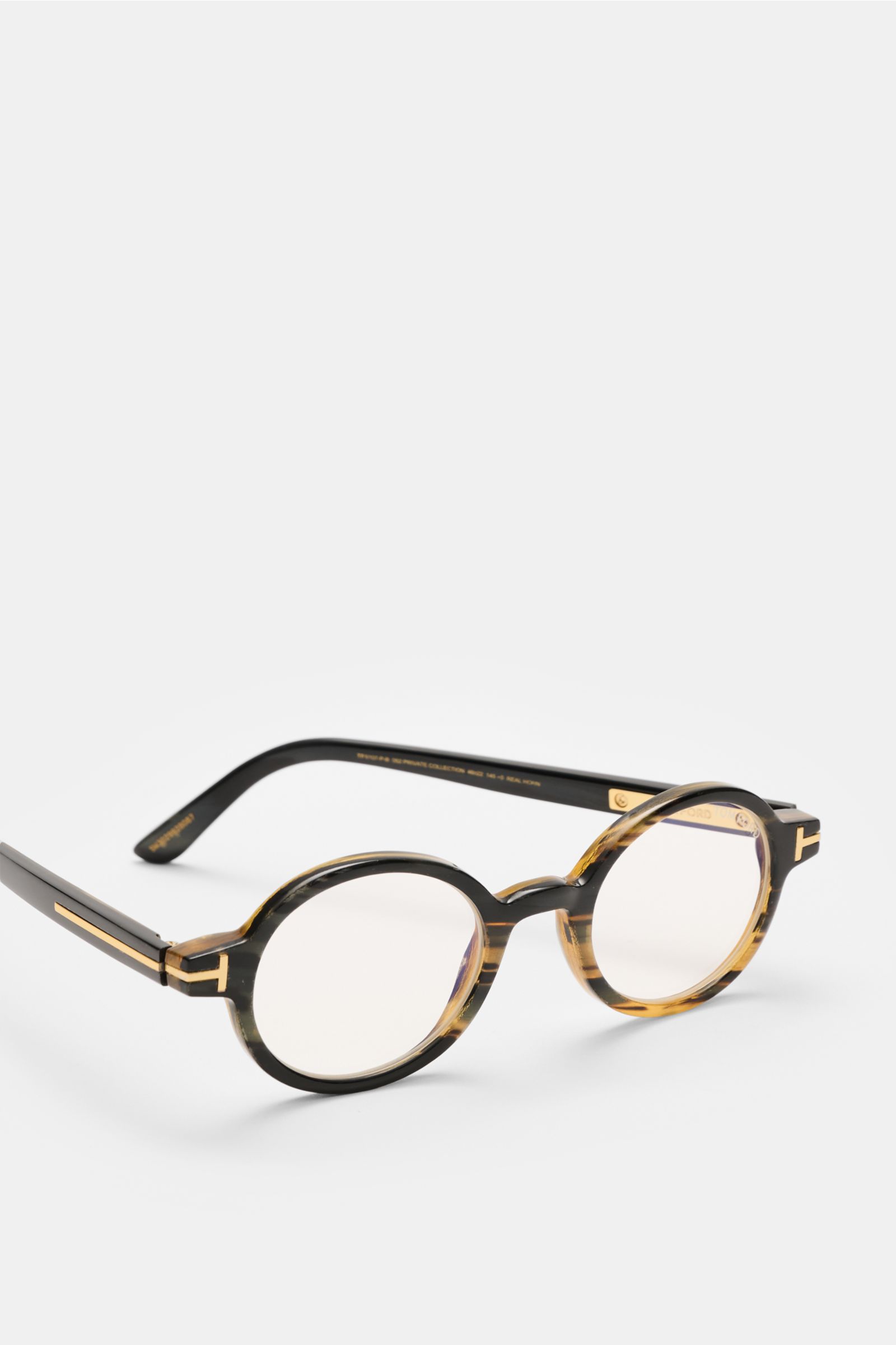 Tom Ford Horn Brille 'Private Collection' schwarz/grau/hellbraun gemustert in runder Form mit Blaulichtfilter, T-Form Detail, seitliche Nahaufnahme, Rahmen aus Büffelhorn.