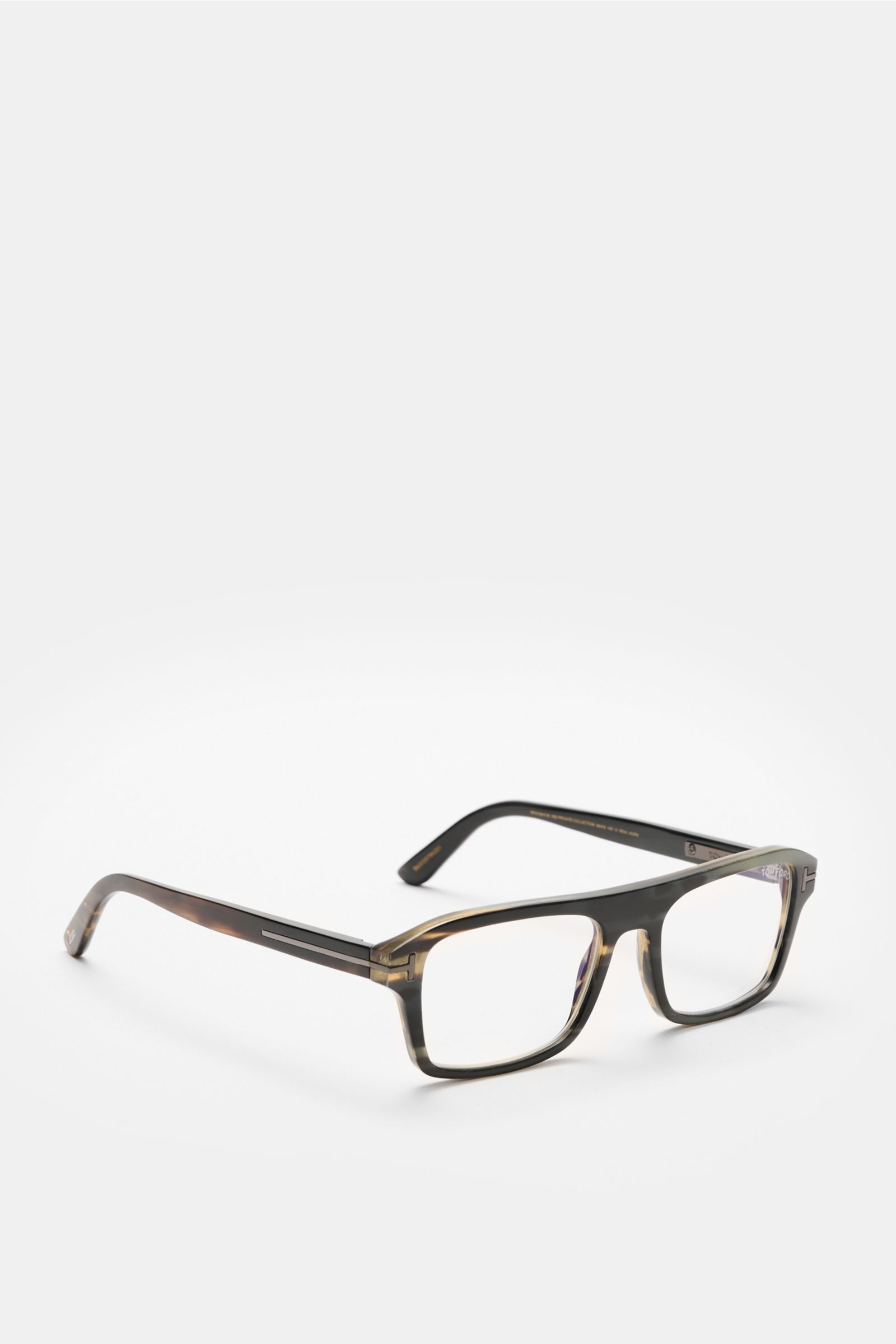 Front-side angled view of Tom Ford Horn Brille 'Private Collection' schwarz/grau gemustert with rectangular buffalo horn frame, blue light filter lenses, T-shaped details, and included leather case, polishing set, and cleaning cloth.