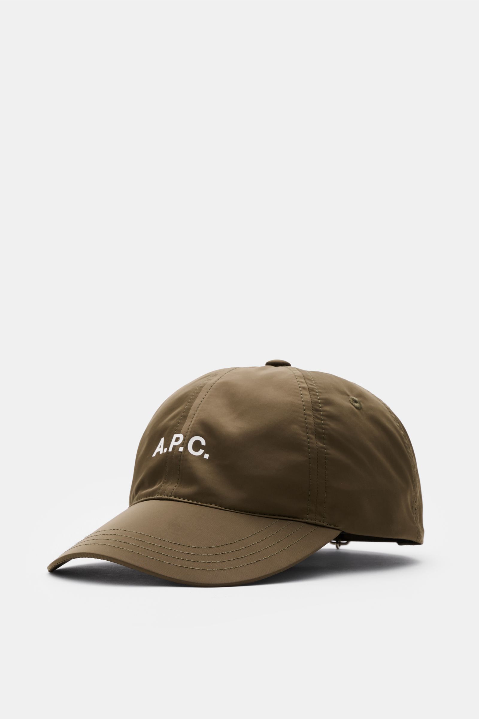 A.P.C. Baseball-Cap 'Charlie' khaki shown from front-left angle, lightweight microfiber, six-panel design, logo print on front, adjustable closure, casual Paris urban style.