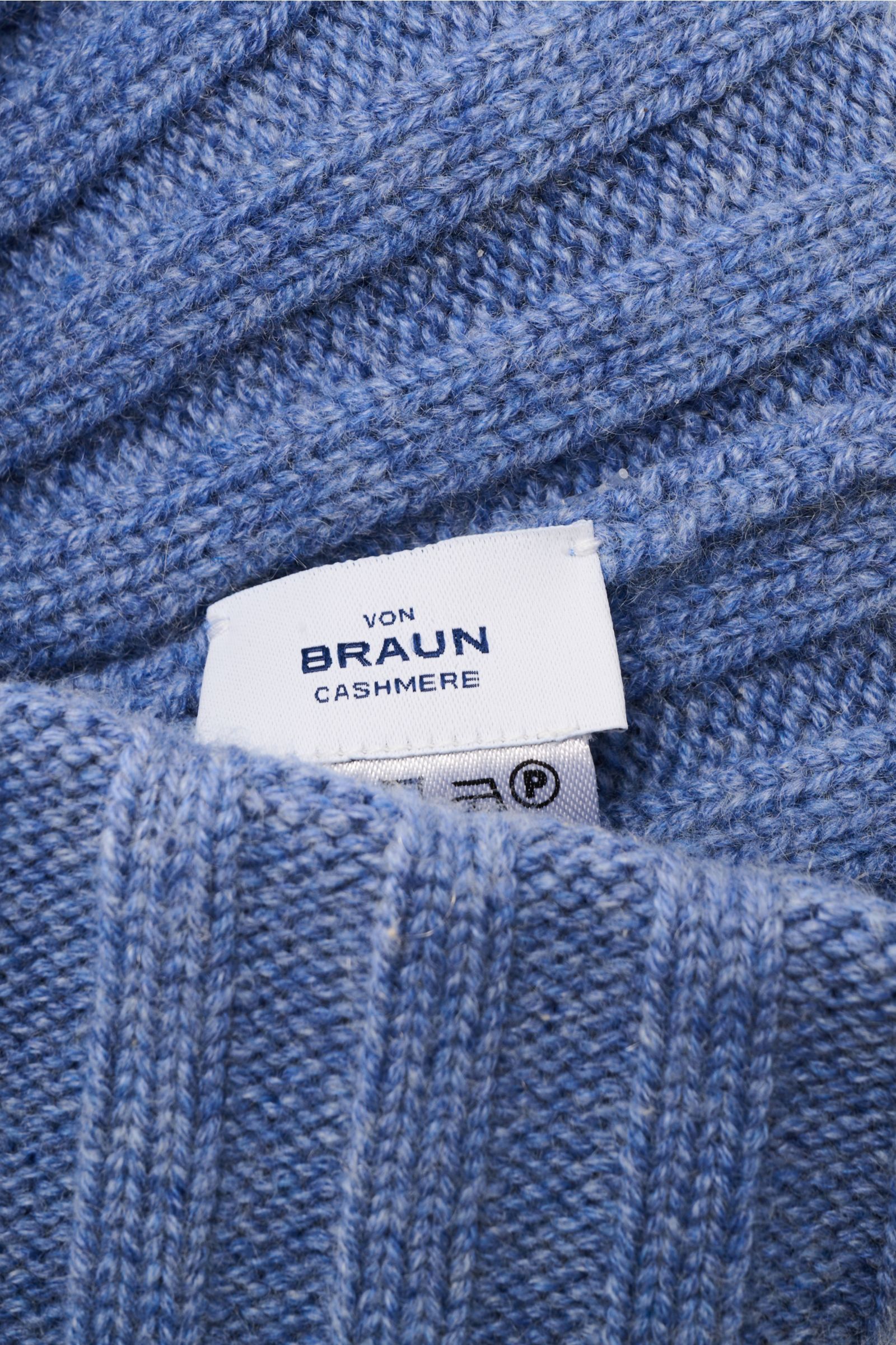 Close-up, top-down view of the von Braun Cashmere beanie blue mottled showing fine rib knit pattern and soft texture with label visible. Whether worn with a classic winter coat or a highly functional down jacket, this soft VON BRAUN knitted beanie made of