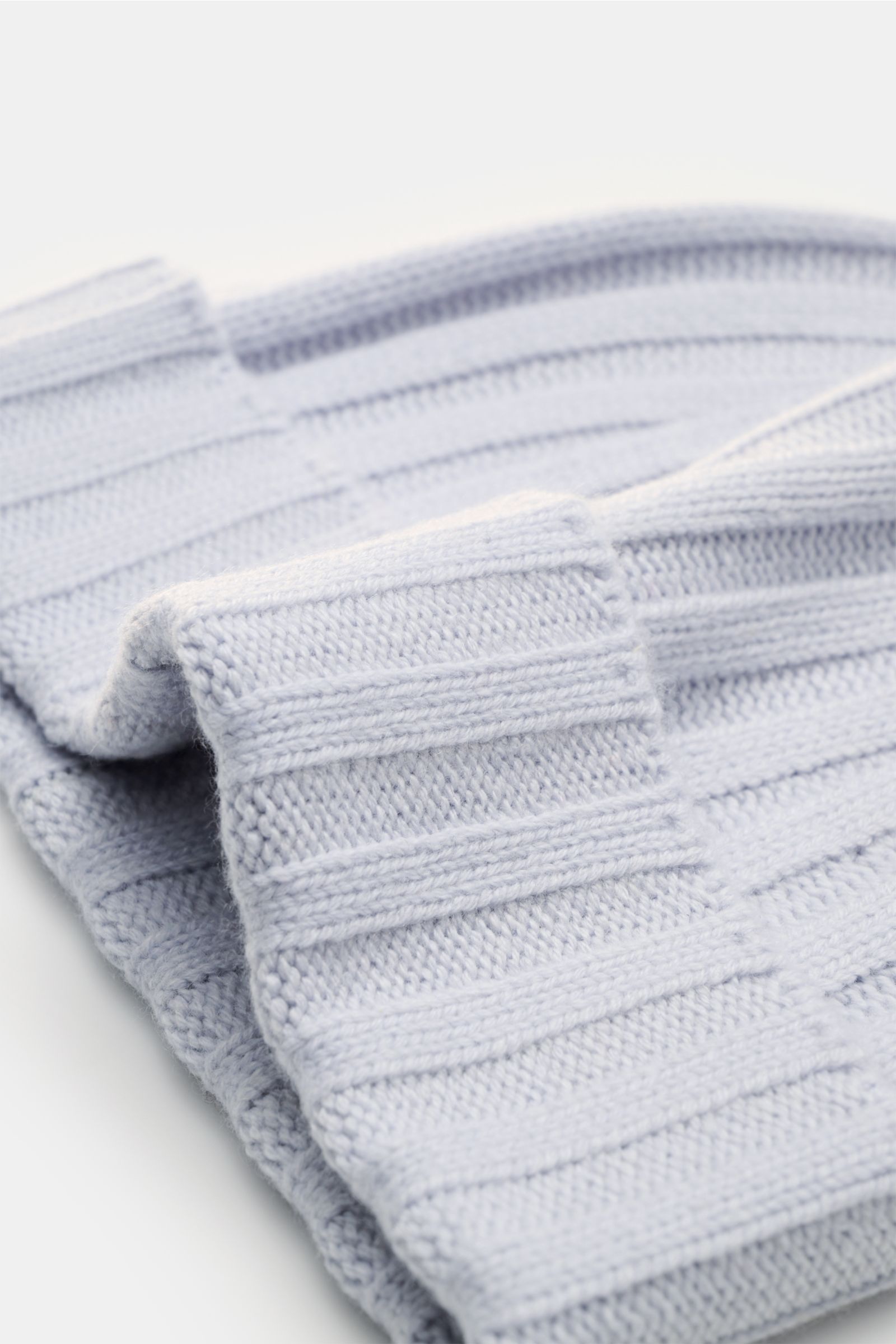 Close-up front angle of von Braun Cashmere beanie light blue, showing fine rib knit, pure cashmere, very soft feel, small turn-up.