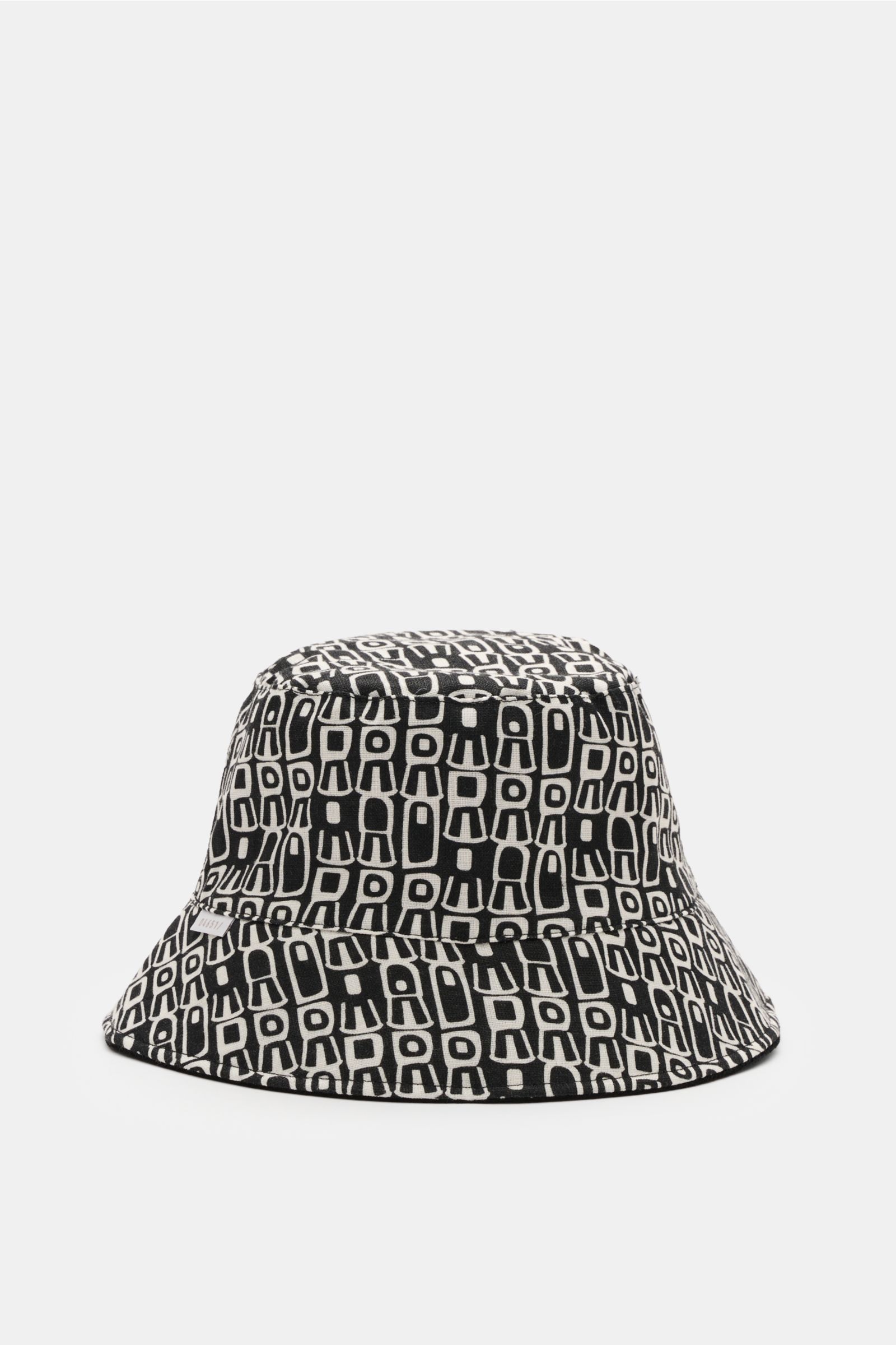 04651/ A trip in a bag Wende-Frottee Bucket Hat schwarz, schwarz-weiß gemustert, schmale Krempe, weiche Baumwolle, wendbar, seitlich Weblabel, Frontansicht.