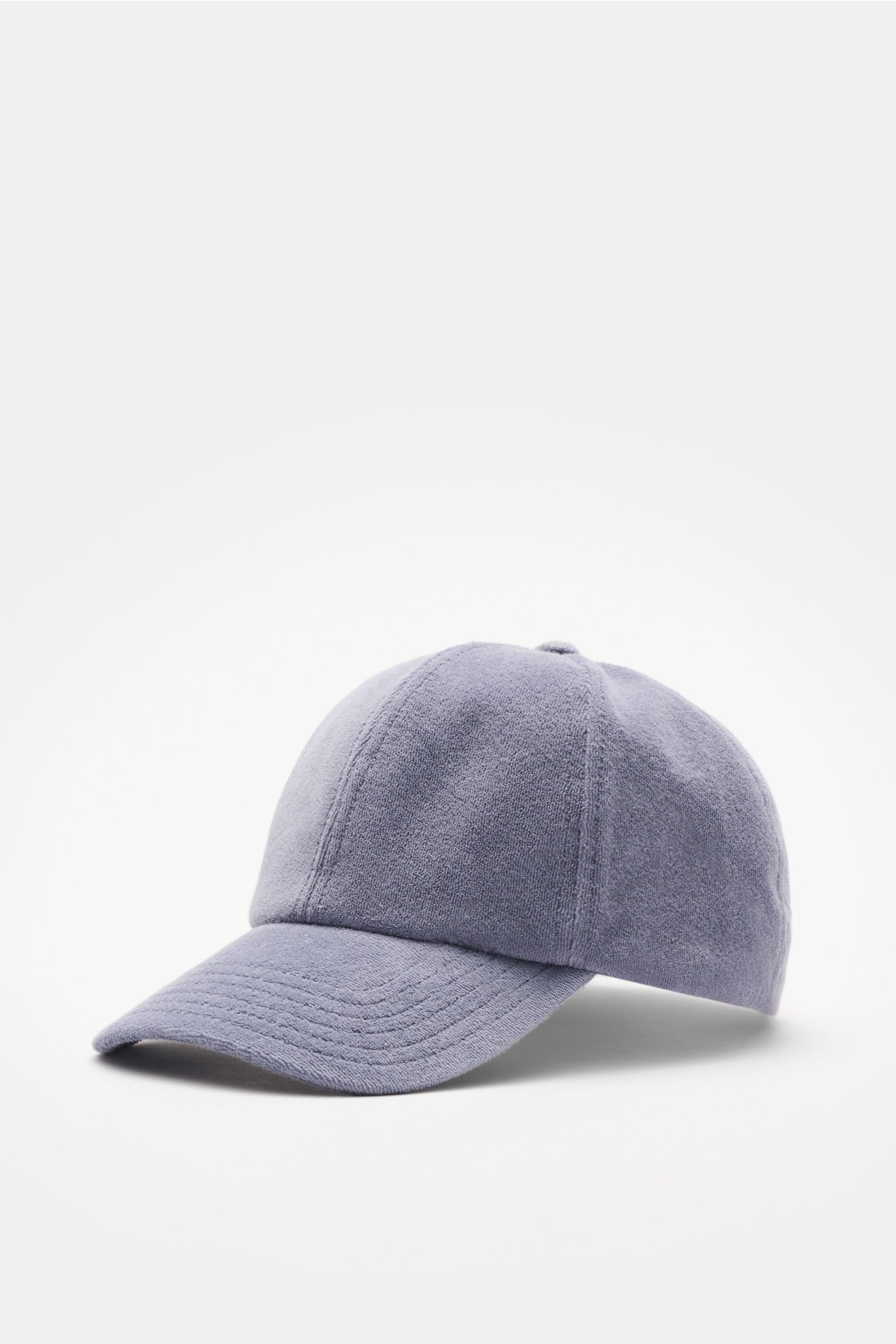 Front-side view of 04651/ A trip in a bag Terry baseball cap 'Terry' smoky blue in soft cotton terry, six-panel style with adjustable closure, offering a soft feel. Spring awakening: This stylish baseball cap in soft terry by label 04651/ A TRIP IN A BAG 