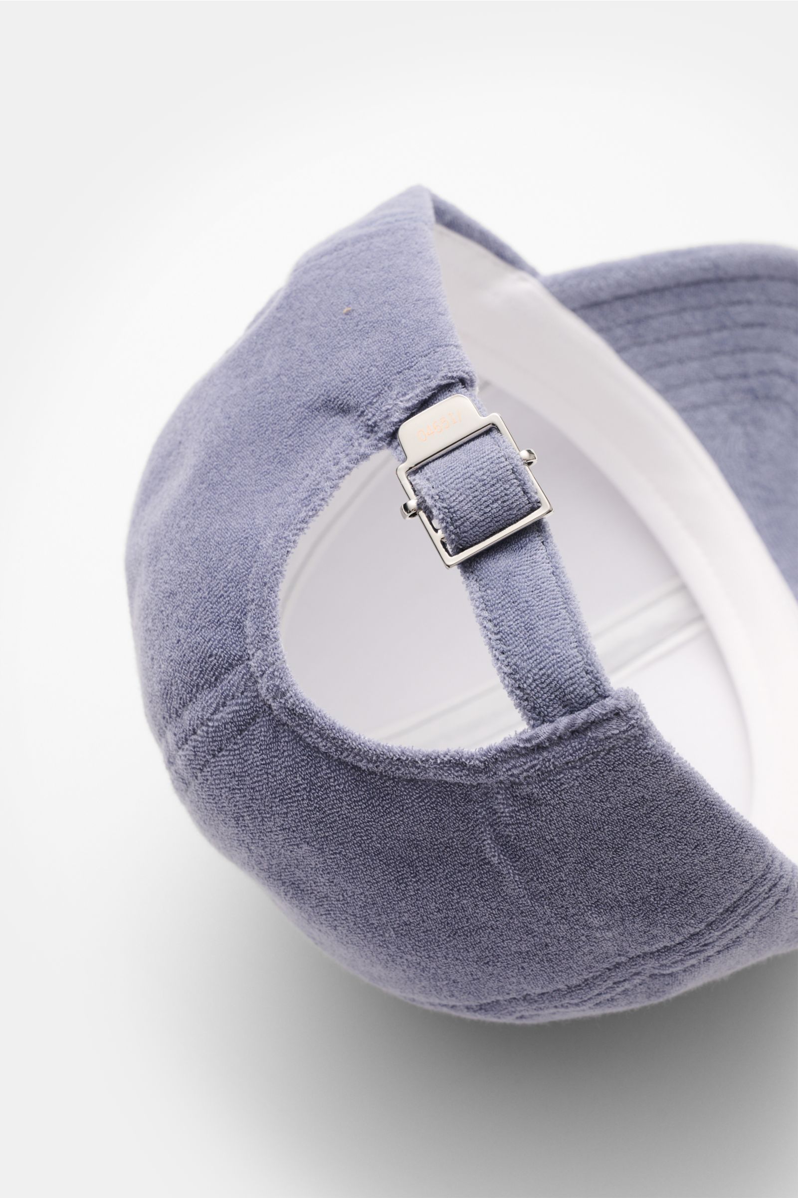 Rear angled close-up of 04651/ A trip in a bag Terry baseball cap 'Terry' smoky blue in soft cotton terry with adjustable closure, six-panel style, soft feel; spring awakening, sporty or trendy preppy accessory.