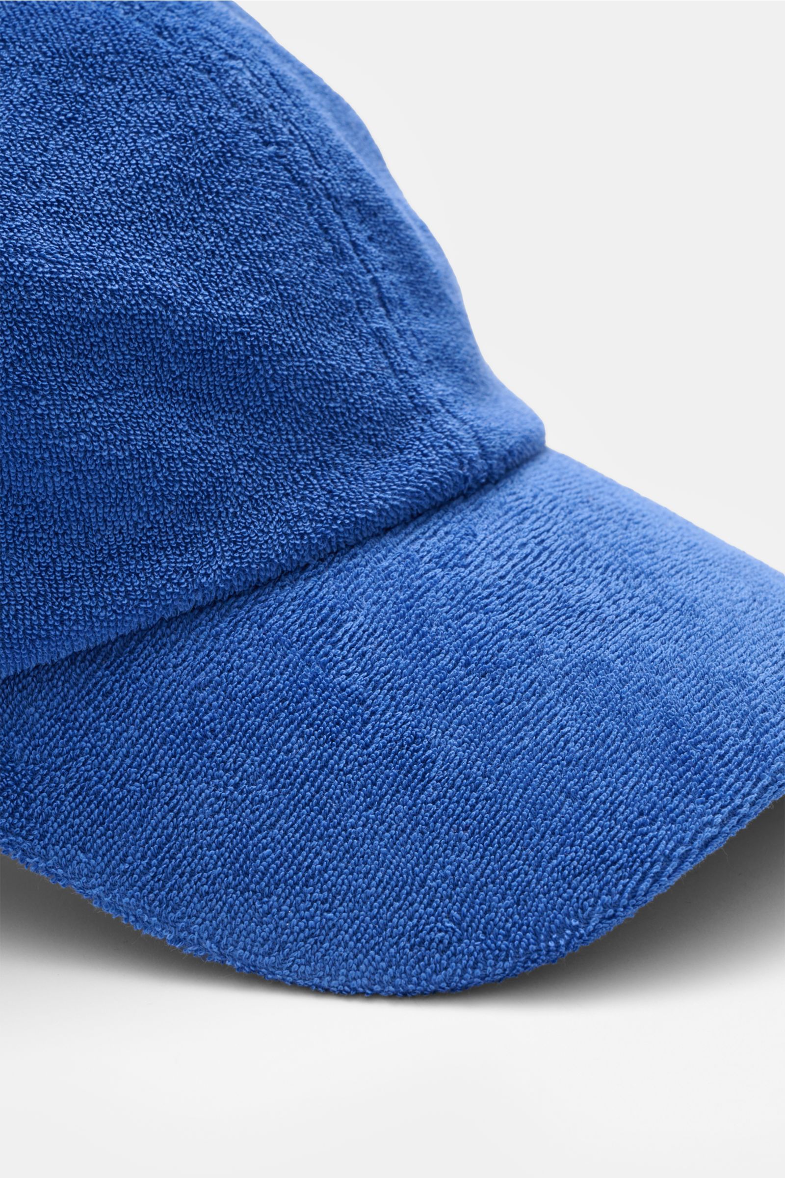 Close-up front angle of the 04651/ A trip in a bag Terry baseball cap 'Terry' blue in soft cotton terry fabric with six-panel style and adjustable closure.