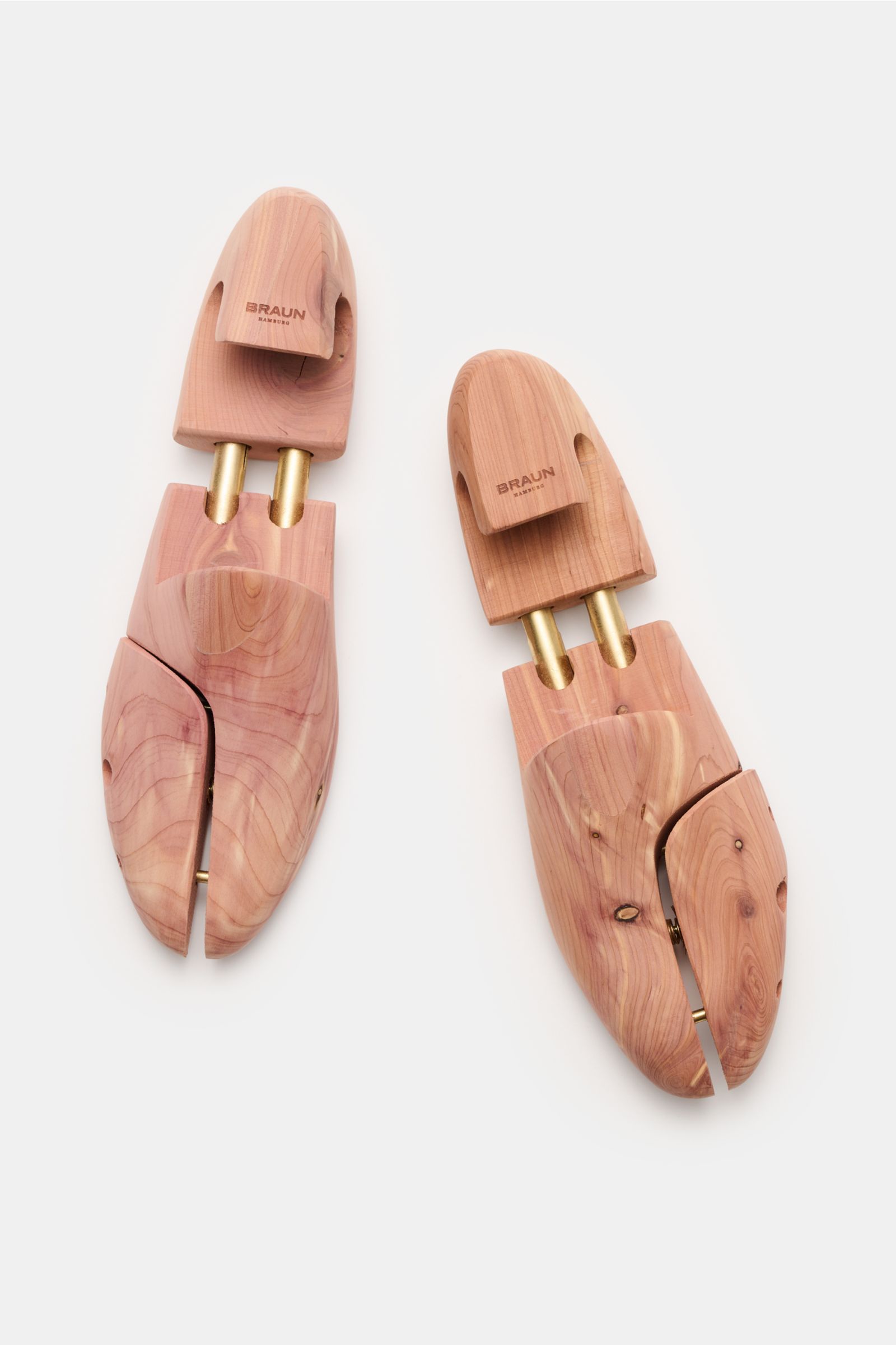 Top-down view of a pair of BRAUN Hamburg Cedar wood shoe trees made of scented cedar wood with brass heel grips and double telescopic springs.

A must-have after wearing your shoes and for storage: This luxury shoe tree by BRAUN Hamburg is made of deod