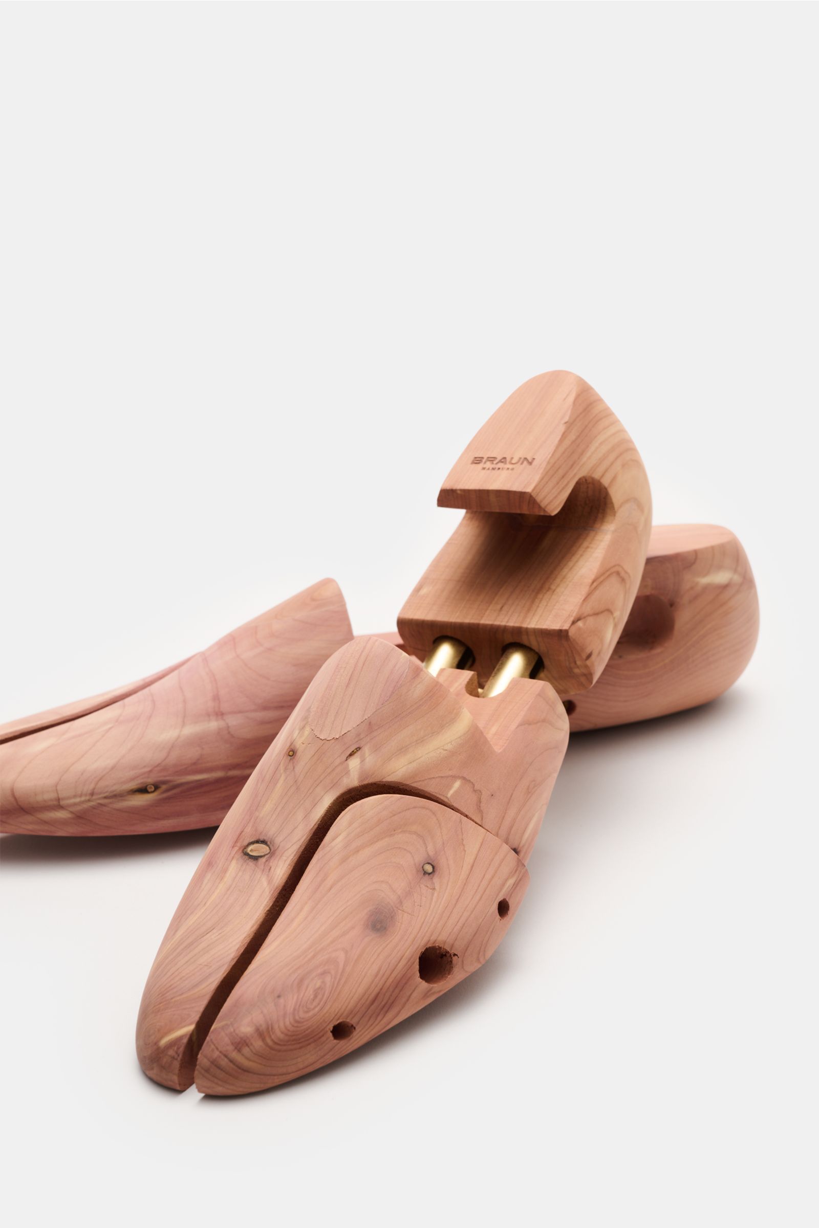 Close-up front-side perspective of BRAUN Hamburg Cedar wood shoe tree made of scented cedar wood with brass heel grip and double telescopic springs.

A must-have after wearing your shoes and for storage: This luxury shoe tree by BRAUN Hamburg is made o
