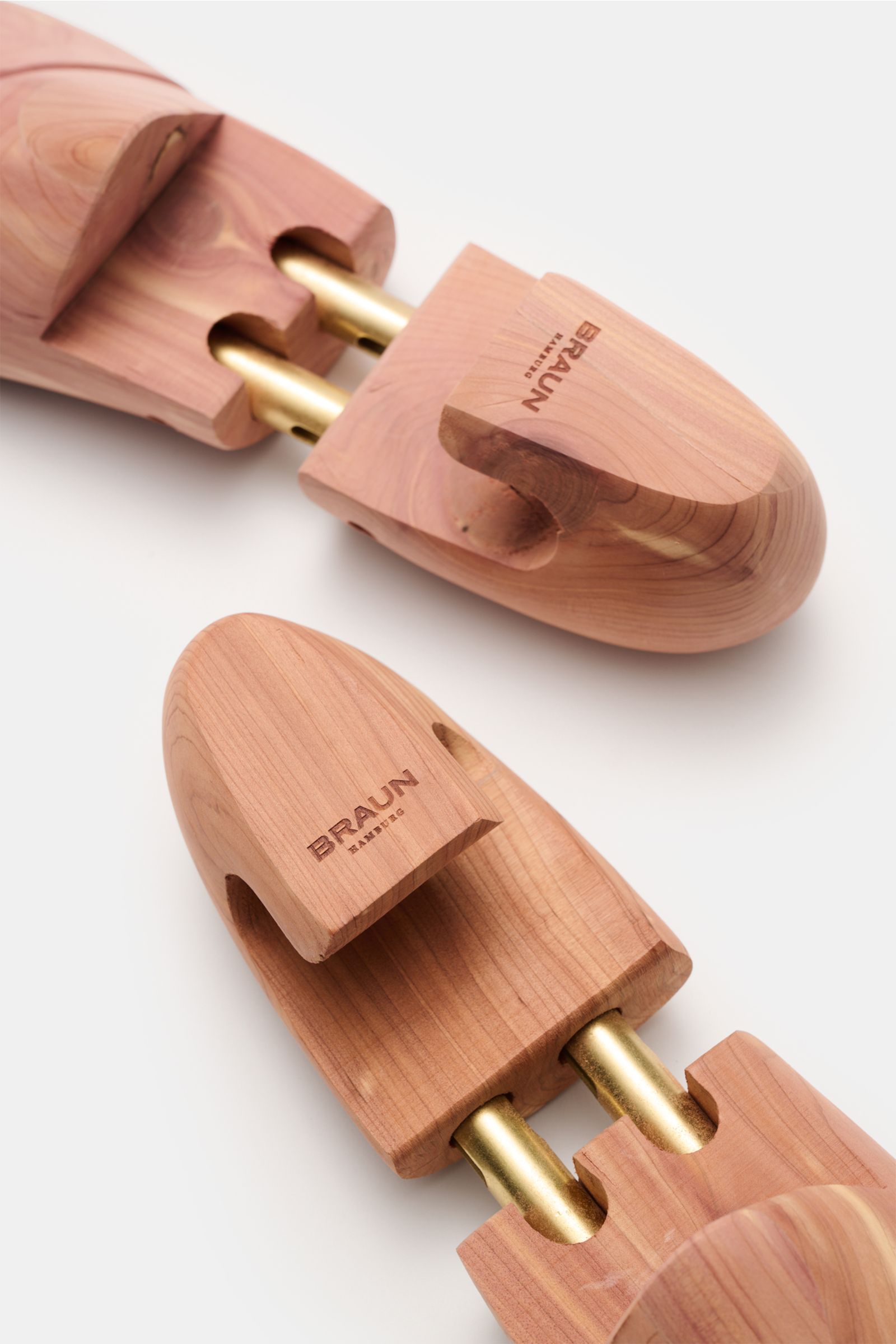Close-up top view of BRAUN Hamburg Cedar wood shoe tree made of scented cedar wood with brass heel grip and double telescopic springs.

A must-have after wearing your shoes and for storage: This luxury shoe tree by BRAUN Hamburg is made of deodorising 