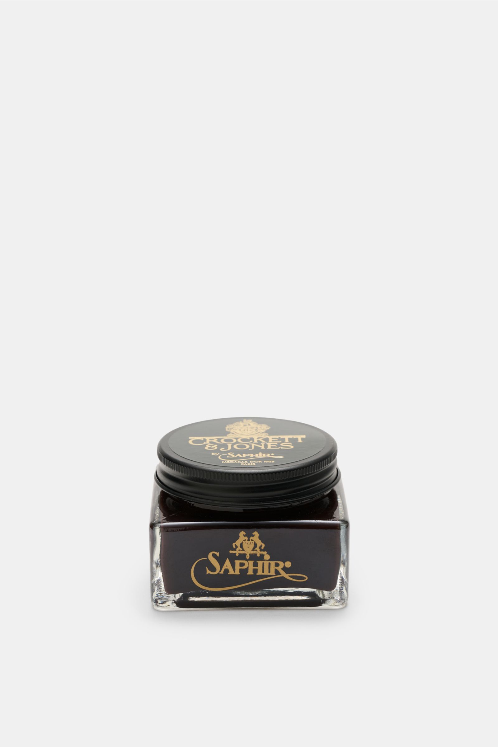 Front view of Crockett & Jones Shoe polish brown 75 ml in a square glass jar with a black lid, gold lettering, nourishing cream polish for smooth leather with high wax content, keeps leather supple, enhances colour and shine.