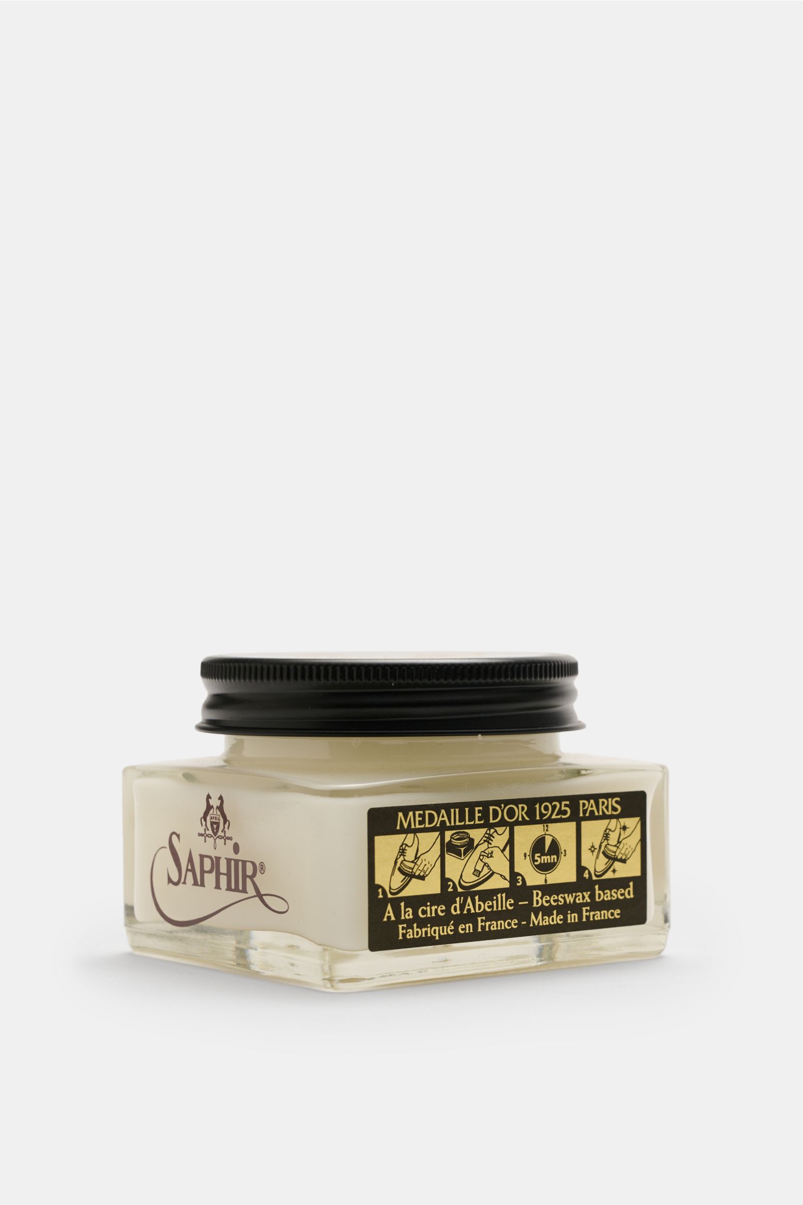 Crockett & Jones Shoe polish translucent 75 ml shown from a low front angle, in a clear square glass jar with black lid, beeswax-based cream nourishing and enhancing smooth leather with high wax content for colour, shine, and suppleness.