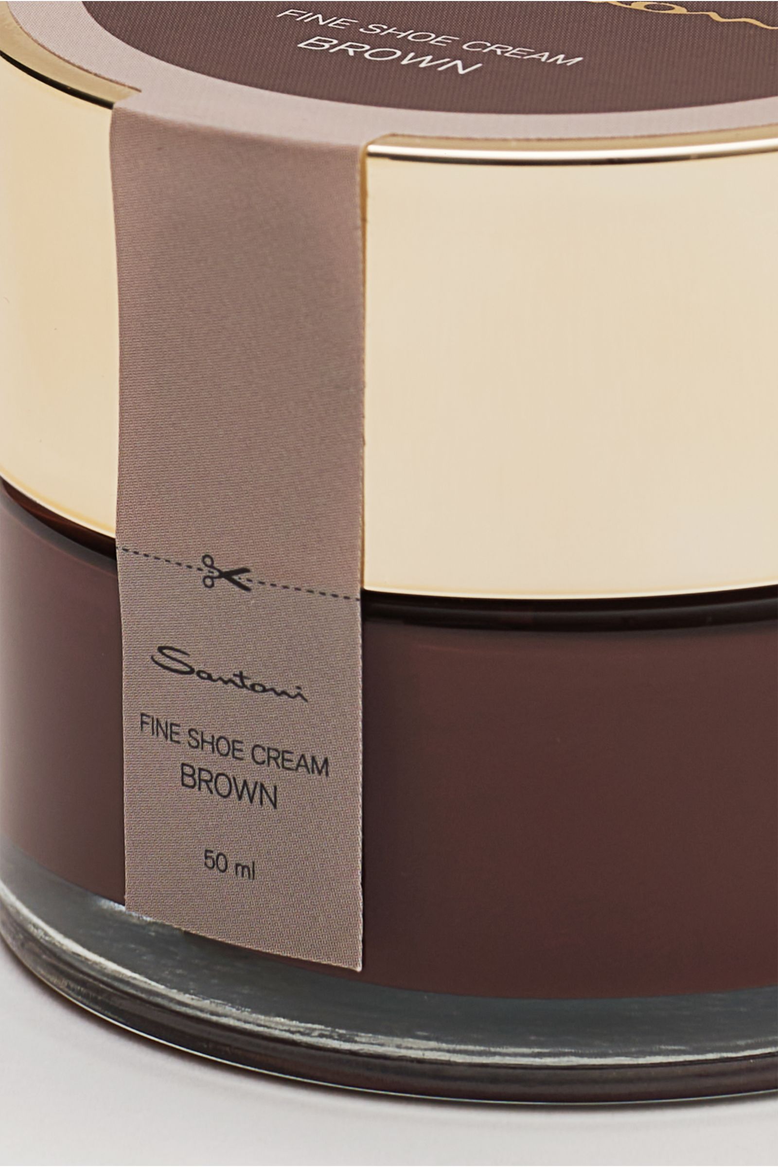 Close-up front-side view of the Santoni Schuhcreme braun 50 ml shoe cream jar with beige lid and brown label. Unverzichtbares Utensil für die handgearbeiteten Meisterwerke von SANTONI: Perfekt auf den Schuh abgestimmt, bewirken die Inhaltsstoffe dieser