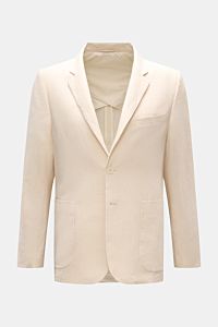 Frontale Nahaufnahme des cremefarbenen Percival Sakko 'Tailored Linen' aus leicht griffigem Leinen-Baumwoll-Mix mit Slim Fit, fallendem Revers, Brusttasche, aufgesetzten Hüfttaschen, Knopfärmeln, Seitenschlitzen und halbfütterung.