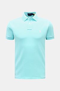 Front view of a slim fit Polo Ralph Lauren Polo shirt light blue made of pure cotton piqué with a signature collar, two-button placket, elasticated cuffs, side vents, and iconic polo rider logo stitching on the chest. 

The classic among polo shirts si