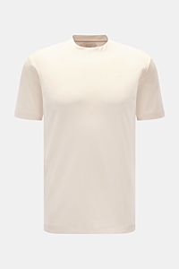 Front view of Aurélien Rundhals-T-Shirt creme, a slim fit, soft cotton tee with round neckline, tonal logo stitching, and short hem slits.