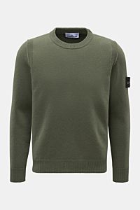 Front view of Stone Island Crew neck jumper 'Lambswool' navy in olive green with slim fit, contrasting knit stripes, and compass badge on the sleeve.

Description: A stylish essential for the colder months: Enjoy the colder seasons in style, with this 