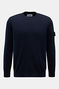 Front view of Stone Island Crew neck jumper navy in pure wool, featuring a soft, fine knit, regular fit, crew neck, tonal compass badge on upper sleeve, and elasticated ribbed bands. 

A timeless piece from STONE ISLAND: If you want to create a warm, s