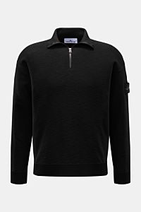 Stone Island Half-zip jumper black shown from the front, featuring a slim fit, standing collar with zipper, purl stitch texture, and signature compass badge. Knit with a twist: The sporty half-zip jumper by STONE ISLAND in a modern purl stitch is an ideal