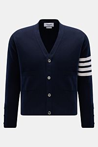 Front view of Thom Browne Cashmere Cardigan navy in pure cashmere with soft touch, fine knit, regular fit, button placket, front pockets, wide rib cuffs, and side buttoned slits.