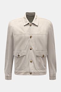 Front view of Rifugio Suede jacket light grey, showcasing smooth suede, slim fit, five-button placket, turn-down collar, patch front pockets with flap, sleeves with cuffs, unconstructed design, soft feel, and two inside pockets. Confident elegance meets e
