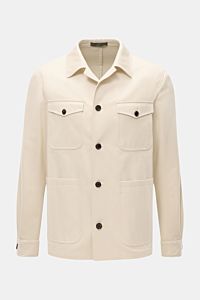 Corneliani Jacke creme aus elastischer Baumwolle, Slim Fit, Umlegekragen, fünf Knöpfe, Brust- und Hüfttaschen, Manschetten, frontale Nahaufnahme.
