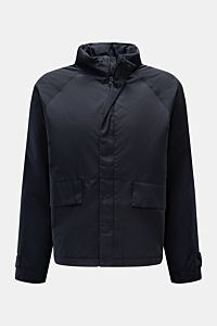 Front view of the 04651/ A trip in a bag Jacket dark navy made of high-quality microfibre, smooth feel, lightweight padding, wind and water repellent, regular fit, zip, concealed hood in collar, raglan sleeves, hip pockets with flap, small woven label in 