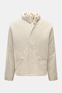 Front view of 04651/ A trip in a bag Jacket sand made of high-quality microfibre with smooth feel, lightweight padding, wind and water repellent, regular fit, zip, concealed hood in collar, raglan sleeves, hip pockets with flap, small woven label in side 