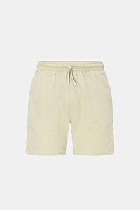 Front view of 04651/ A trip in a bag Swim shorts 'Mono Seersucker' sage in light green with elastic waistband and drawstring.

Description: Perfect for your next summer holiday: With their design in seersucker look, these swim shorts by 04651/ A TRIP I