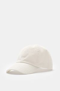 Front-side view of the 04651/ A trip in a bag Terry baseball cap 'Terry' cream in soft cotton terry, six-panel style with adjustable closure, offering a soft feel. Spring awakening: This stylish baseball cap from 04651/ A TRIP IN A BAG provides good prote