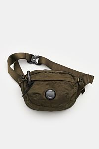 C.P. Company Belt bag olive shown from above, compact, piece-dyed, water repellent microfibre with adjustable belt, signature lens detail, padded back, and multiple zip compartments for flexible wear. Don’t go on trips or into the city without this compac