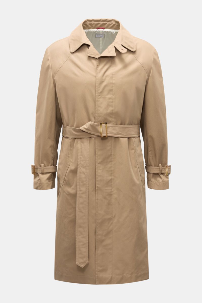 Front view of a beige Brunello Cucinelli Trenchcoat made from a cotton and microfiber gabardine blend, featuring a smooth, breathable, and water-repellent fabric with a regular fit, concealed button placket, belted waist with horn buckle, adjustable sleev