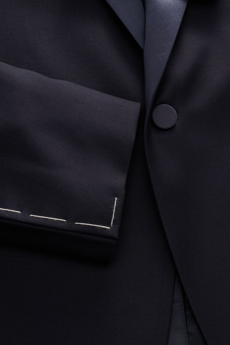Close-up front view of the Tagliatore Tuxedo navy showing the slim fit, one-button jacket in pure Super 110'S virgin wool with satin lapel.
