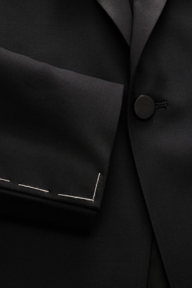 Close-up front view of Tagliatore Tuxedo black lapel and button in pure Super 110'S virgin wool with smooth feel, slim fit.