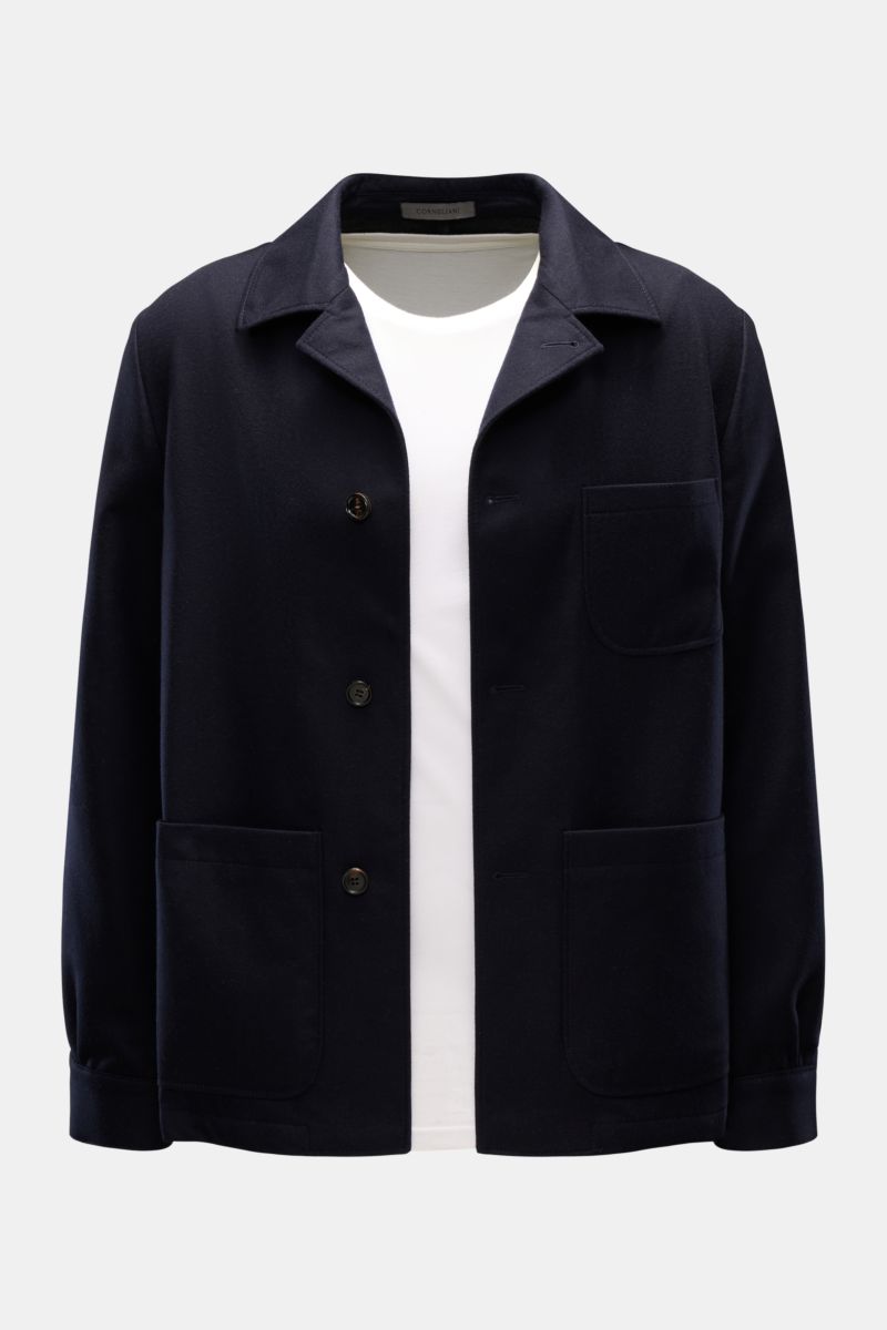 Front view of Corneliani Overshirt navy in double-face virgin wool and silk, with collar, four-button placket, patch pockets, and cuffs.

This overshirt in virgin wool and silk by CORNELIANI is an elegant shirt-jacket hybrid and enhances a variety of s