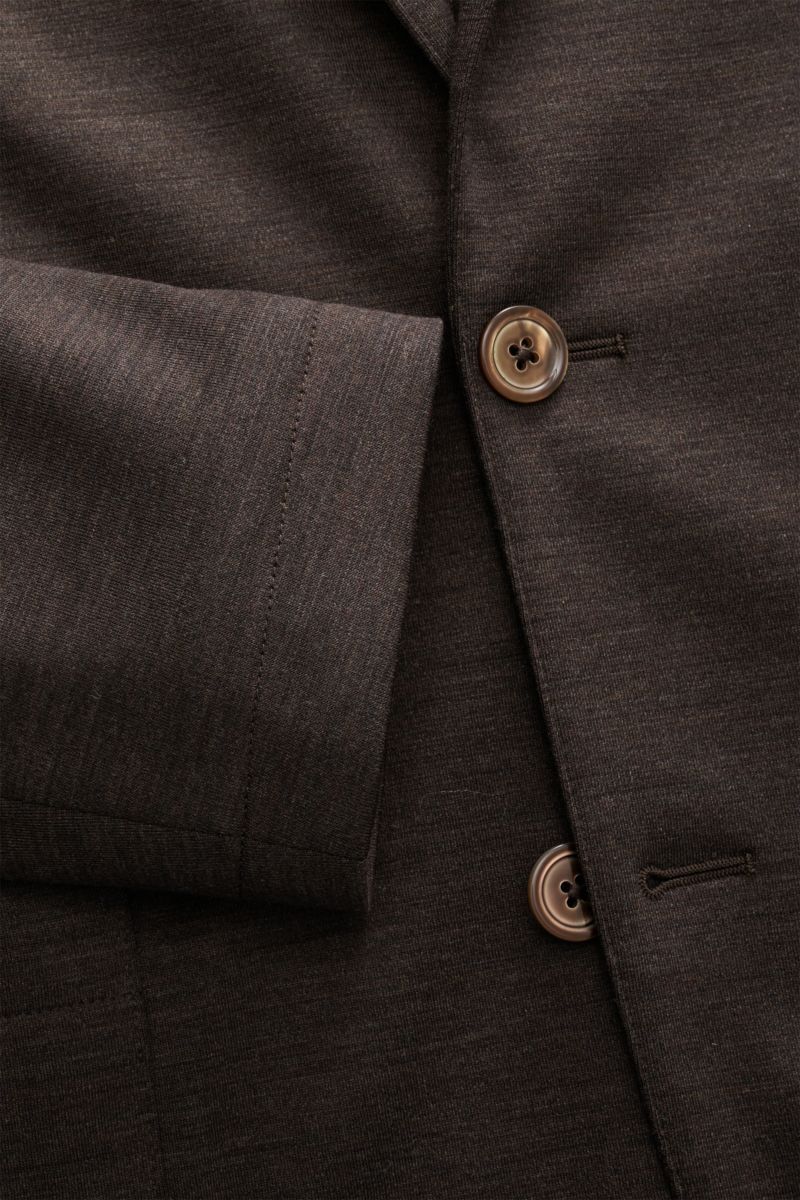 Close-up from above of the Marco Pescarolo Blazer 'Giove' dark brown melange showing fine virgin wool jersey fabric, buttons, and sleeve cuff. Lightweight blazer with maximum comfort: MARCO PESCAROLO designs not only elegant trousers, but also blazers suc