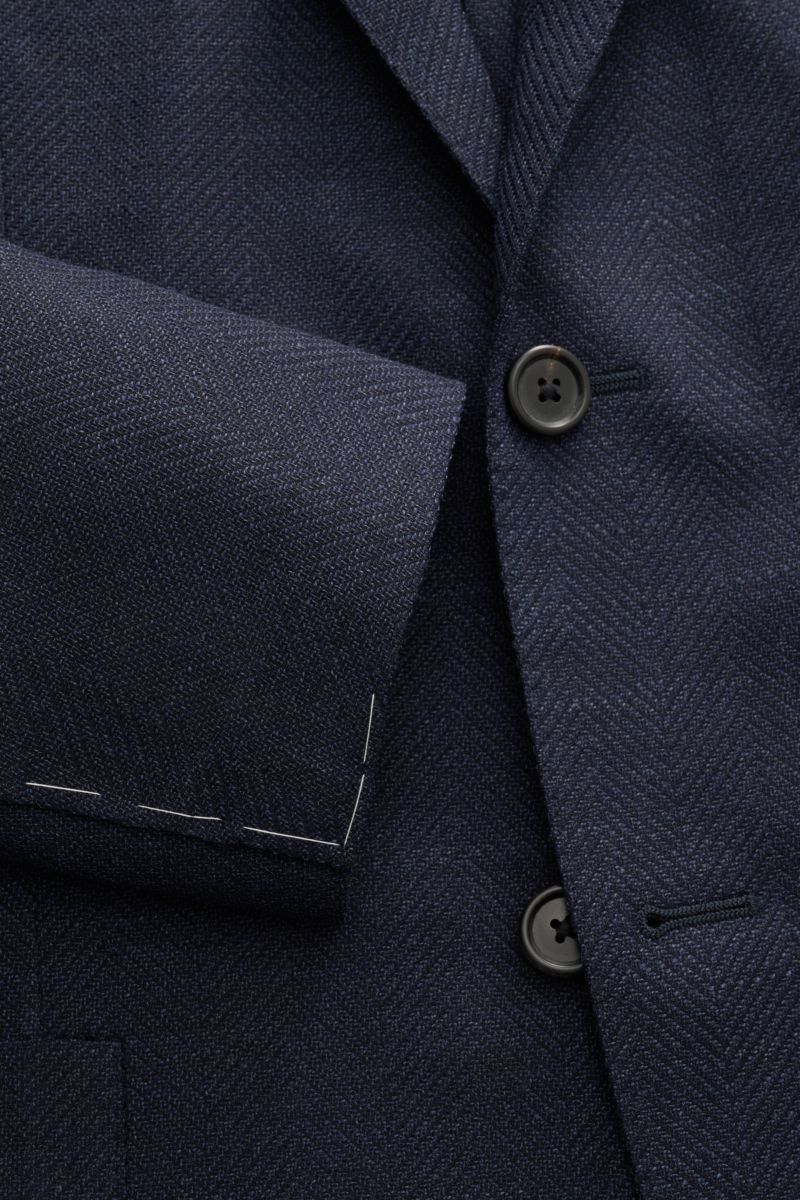 Close-up front view of Corneliani Smart-casual jacket navy mottled in elastic virgin wool, slim fit with two-button style and distinctive weave.  

Timeless sophistication: This CORNELIANI smart-casual jacket, crafted from fine virgin wool, combines cl