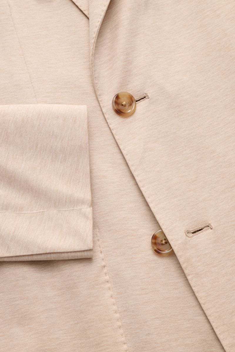 Close-up front view of Lardini Jersey jacket beige mottled showing double-breasted buttons, soft cotton jersey fabric, and unfinished sleeve cuff.

Comfortable and elegant: This double-breasted smart-casual jacket by LARDINI in lightweight cotton jerse