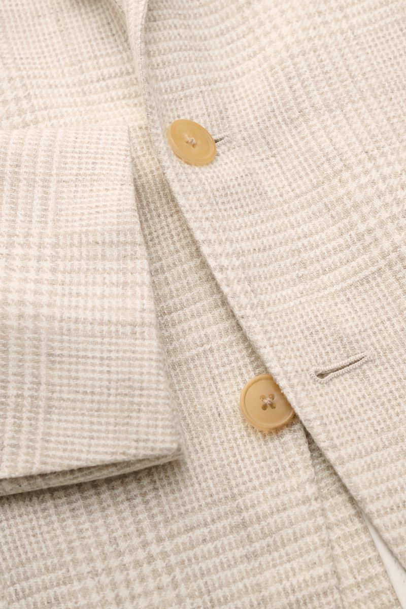 Close-up front view of the Belvest Smart-casual jacket cream/beige checked showing fabric texture, buttons, and subtle glen check pattern.

BELVEST has brought together the best in natural materials – wool, linen, silk and cashmere – in this summery sm