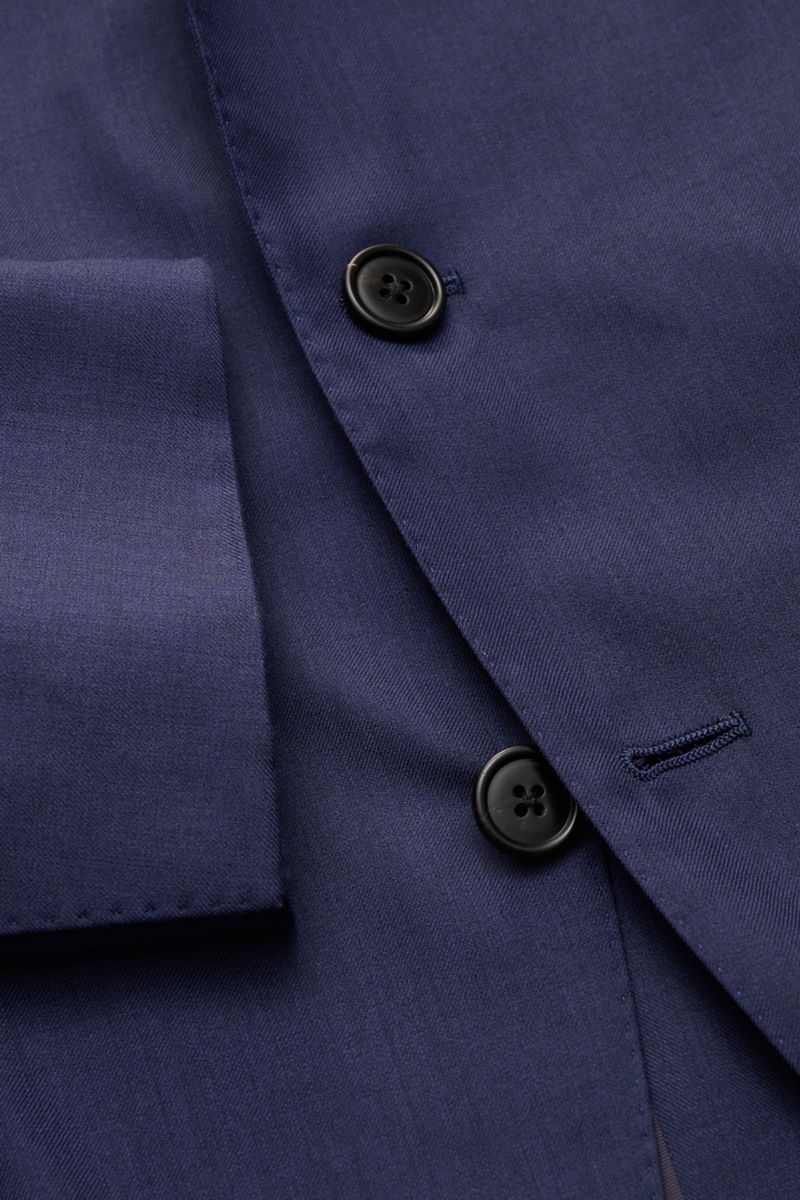 Close-up front view of Belvest Smart-casual jacket navy showing fitted three-button style, wool-silk blend fine twill fabric, step lapel with pin, and unfinished sleeve cuff.