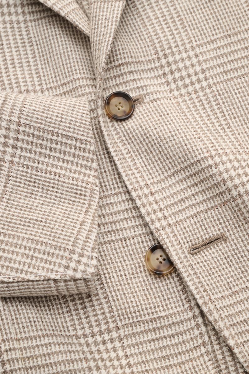 Close-up front view of the Sipario Smart-casual jacket 'Ginza' taupe/cream checked, showing lightweight linen and silk blend fabric, classic glen check pattern, slim fit, three-button style, step lapel, breast and patch hip pockets, unfinished sleeve cuff