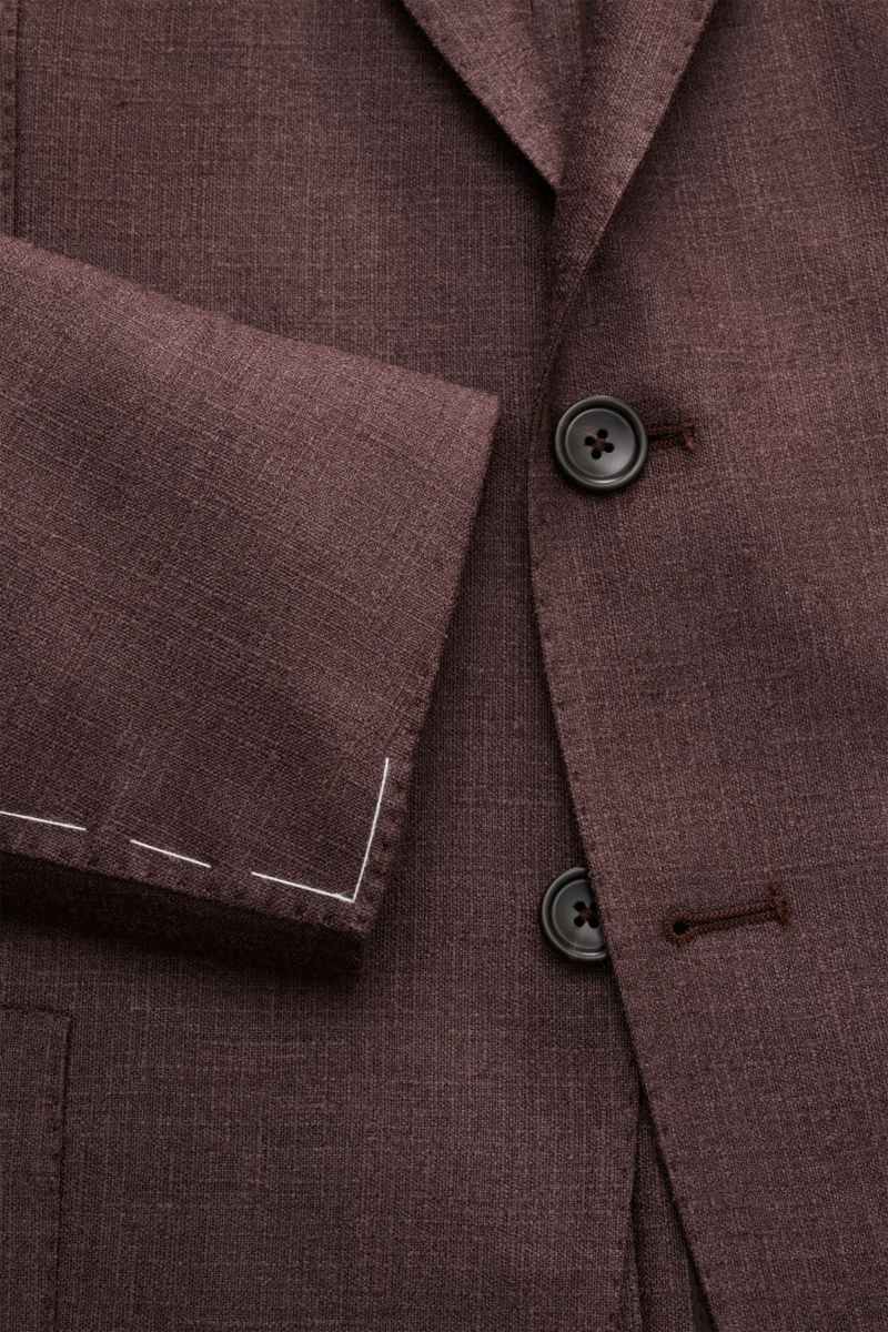 Nahaufnahme des dunkelbraun melierten Tagliatore Sakko 'Monte Carlo' mit feinem Strukturgewebe, Slim Fit, fallendem Revers und zwei Knöpfen.