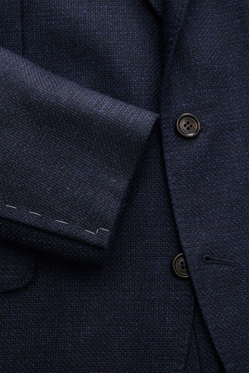 Close-up view of the Brunello Cucinelli Sakko navy meliert fabric and buttons, showing the melierte three-button slim fit jacket with a mix of silk, linen, and wool, soft grainy texture, and distinct woven structure.