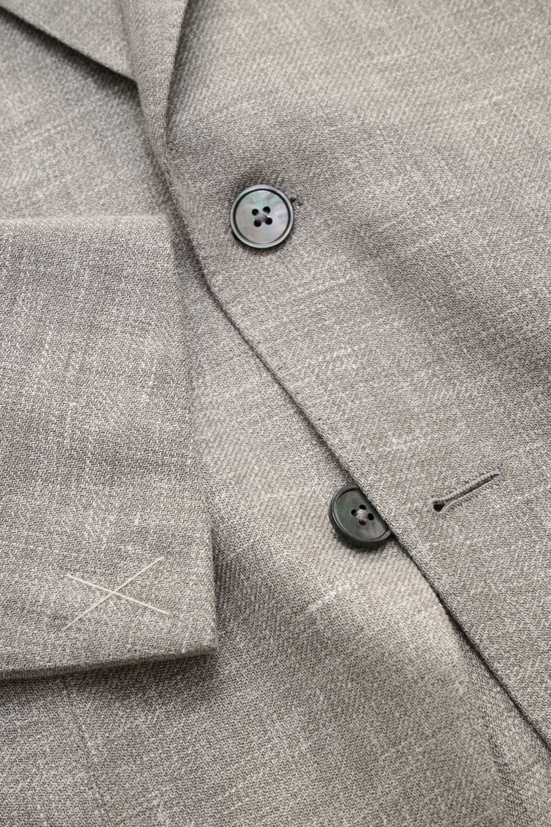 Close-up front view of Zegna Smart-casual jacket 'Riviera' grey/white mottled showing detailed fine weave fabric and buttons.

Description: The smart-casual jacket 'Riviera' by ZEGNA made of linen and wool with silk content has a comfortably soft feel 