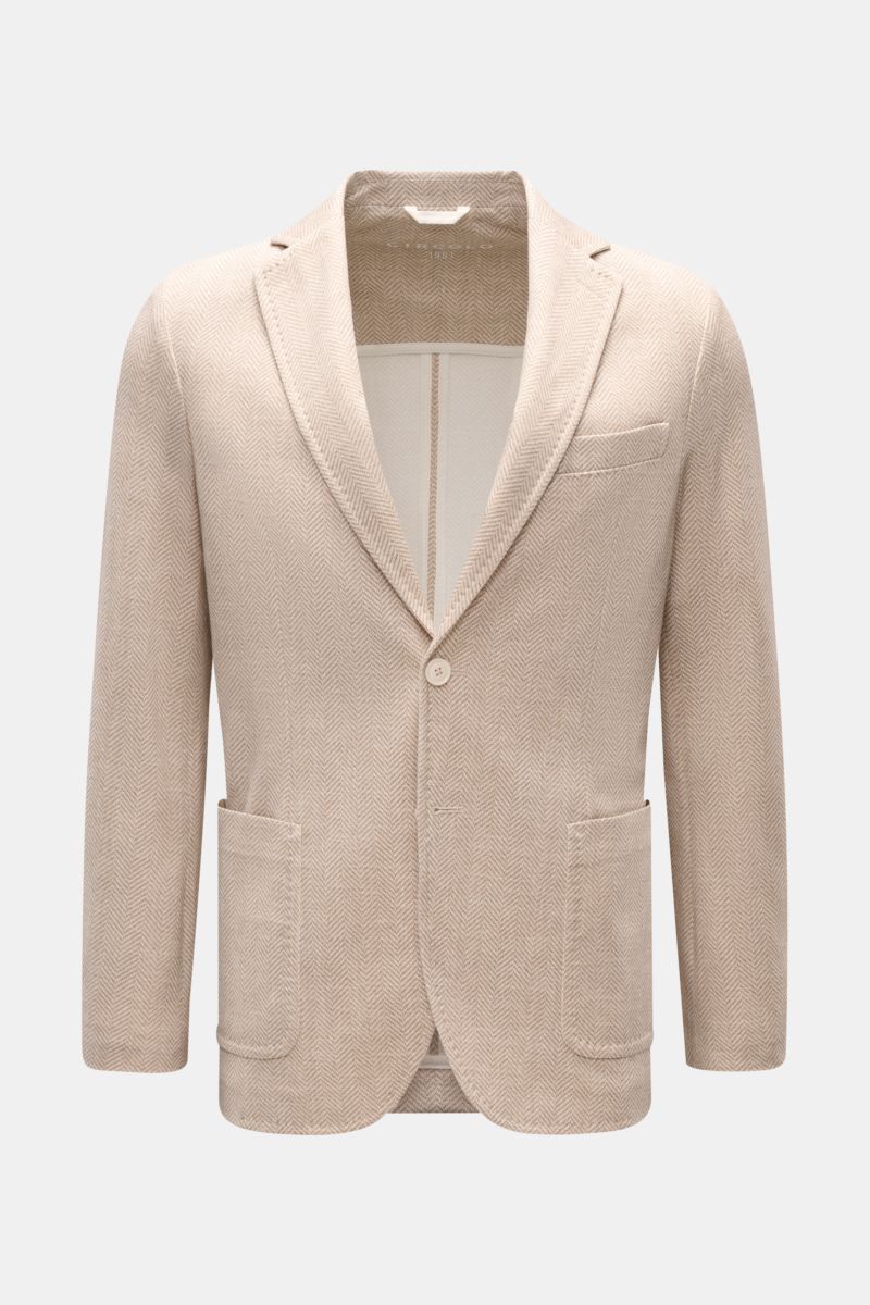 Front view of Circolo 1901 Jersey jacket beige/cream patterned with herringbone, slim fit, two-button style, patch hip pockets, and step lapel.

Description: Casual elegance for warm days: This smart-casual jacket with herringbone pattern by CIRCOLO 19
